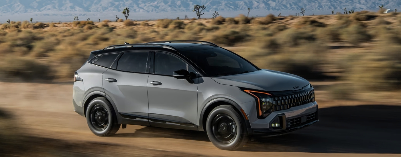 A grey 2026 Kia Sportage for sale near Omaha from the side.