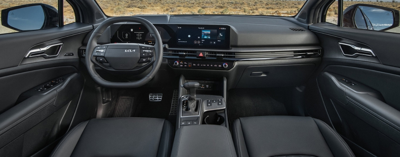 The black interior of a 2026 Kia Sportage.