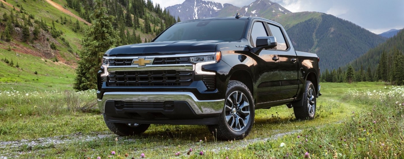 A black 2025 Chevy Silverado 1500 from the front at an angle after leaving a Chevy dealer near me.