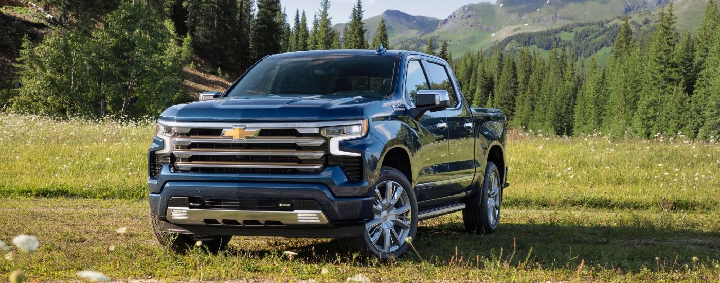 A blue 2025 Chevy Silverado 1500 from the front.
