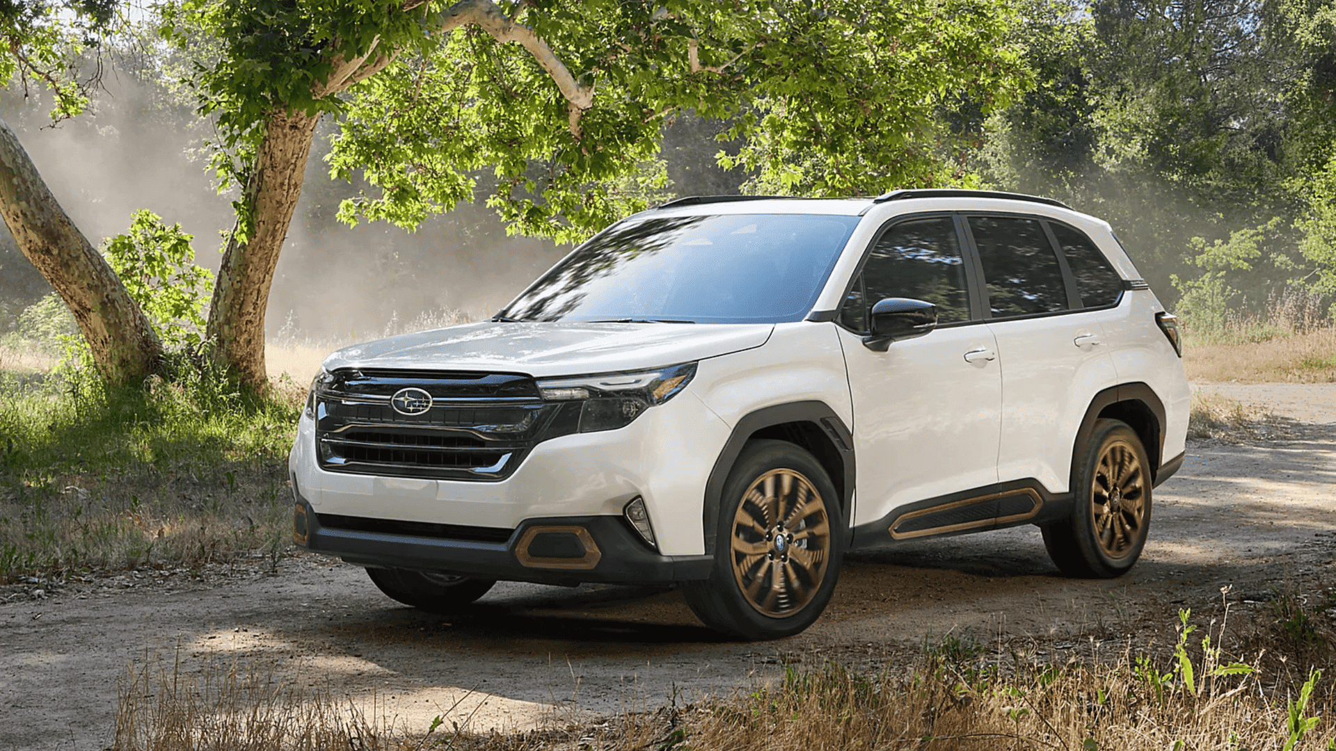 2025 Subaru Forester SUV driving a dirt trail in Beckley WV, showcasing off-road capability.
