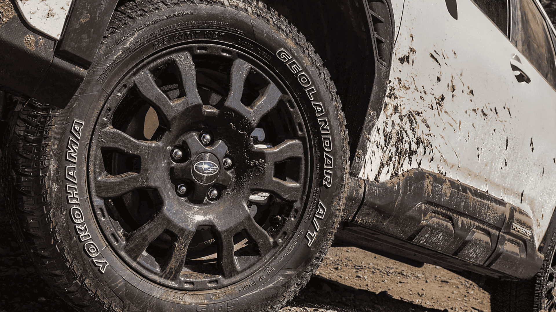 Mud-covered wheel and Yokohama tire of the 2026 Subaru Forester Wilderness after off-road driving.