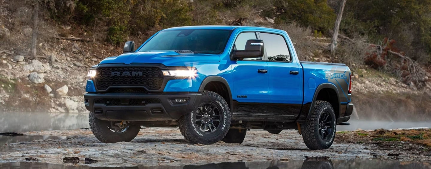 A blue 2025 Ram 1500 for sale near Council Bluffs from the front at an angle.