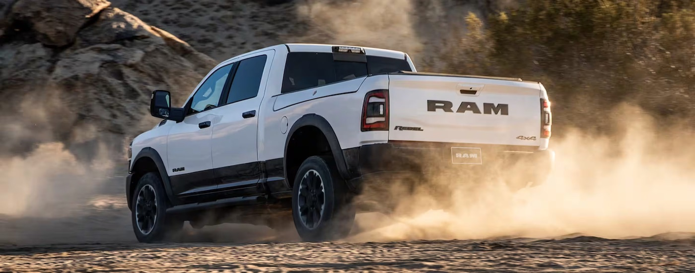 A white 2025 Ram 2500 from the rear at an angle after leaving a Ram dealer near Hempstead.