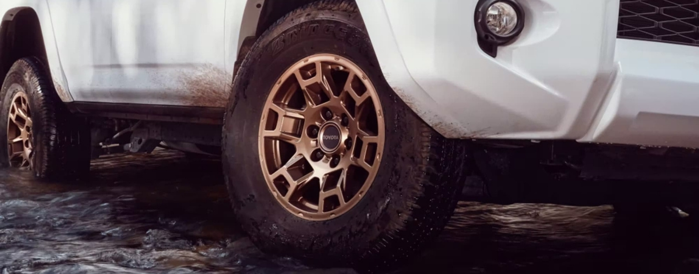 Gold wheel on a white 2023 Toyota 4Runner 40th Anniversary.