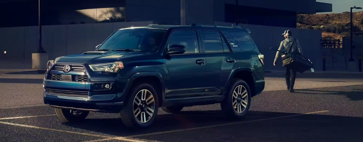 Dark blue 2023 Toyota 4Runner TRD Sport in a parking spot.