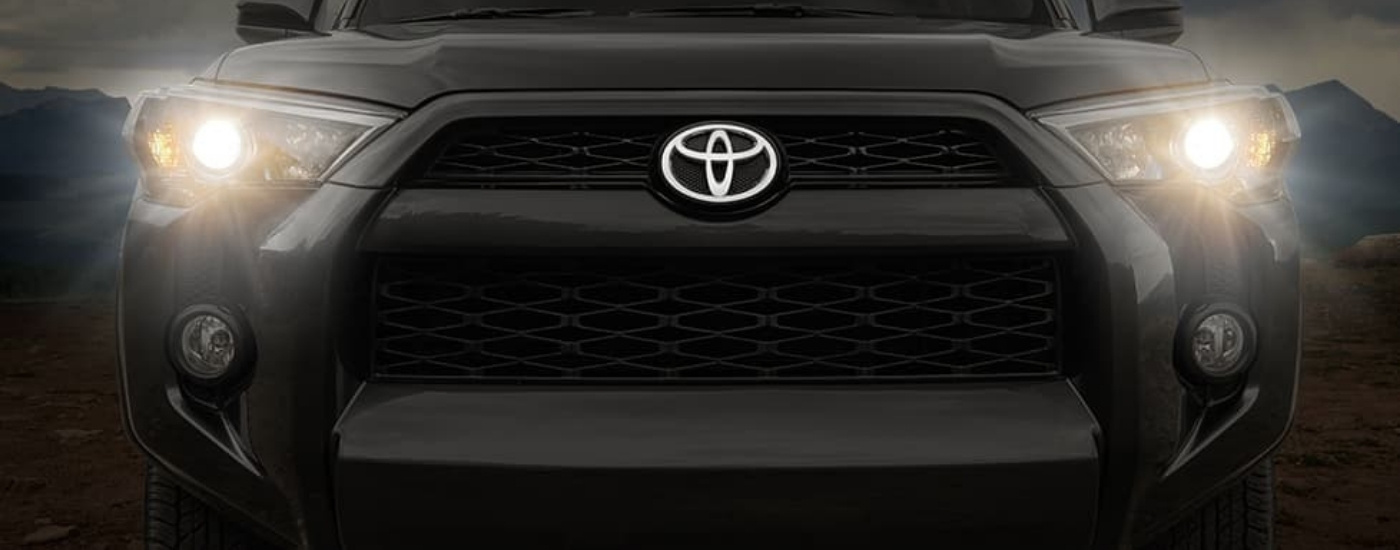 Illuminated headlights on a dark grey 2018 Toyota 4Runner for sale near Canyon Lake.