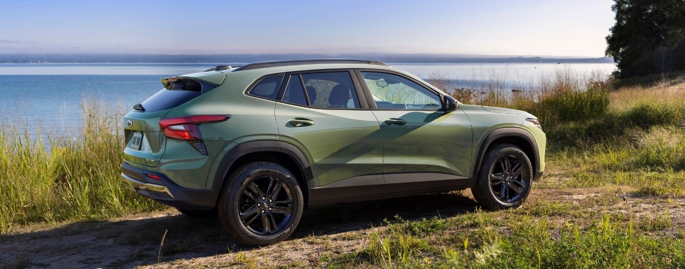 A green 2025 Chevy Trax from the side.