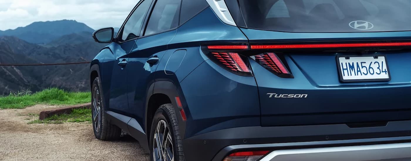 Rear and side of a blue 2026 Hyundai Tuscon for sale near Manvel