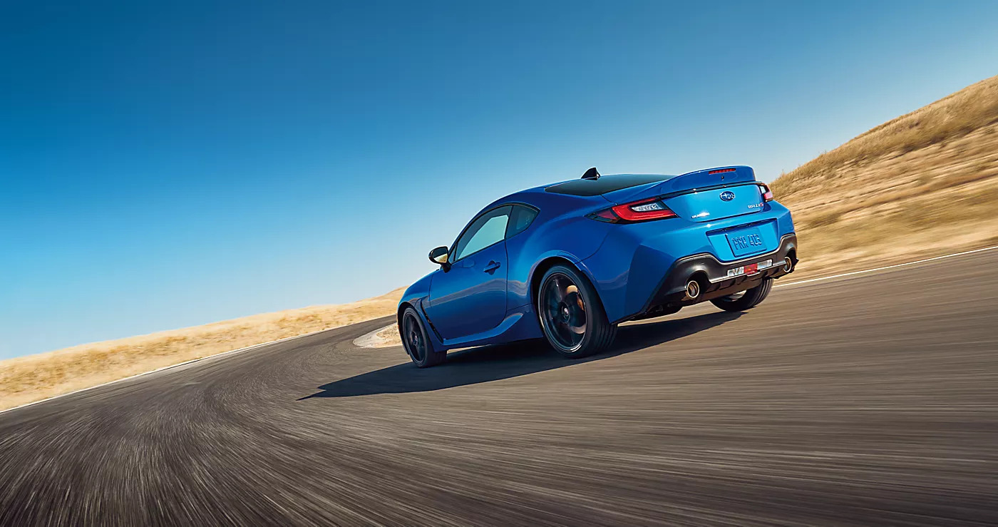 2025 subaru brz speeding down a road in the dessert