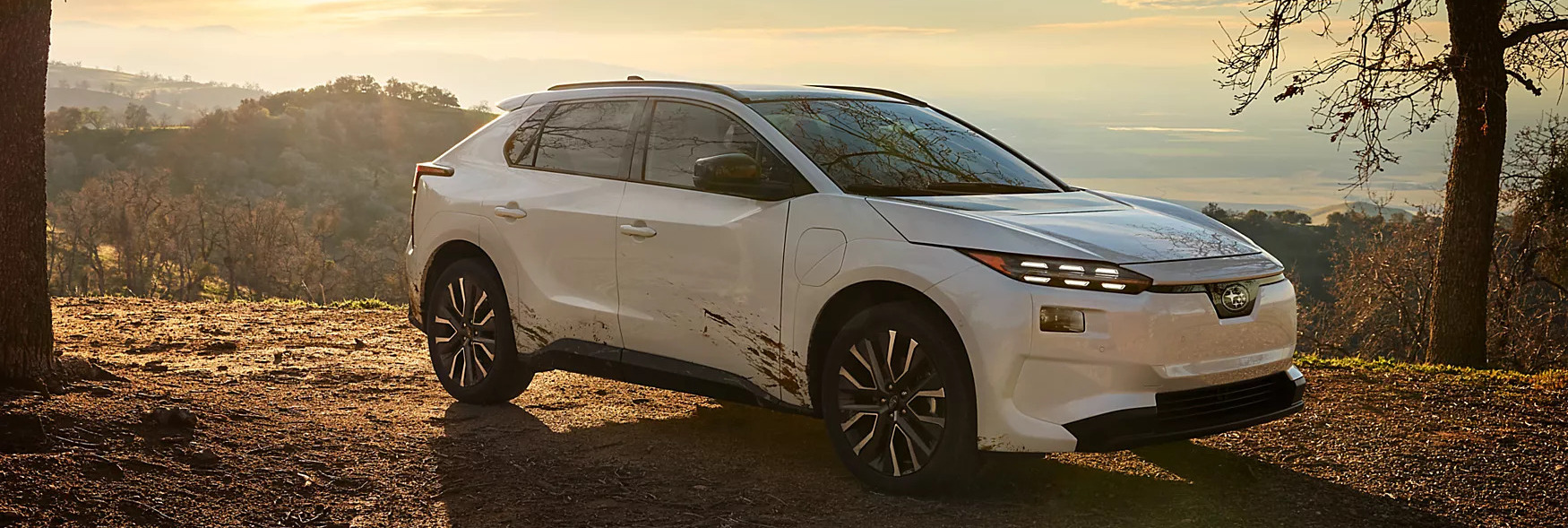 all new 2026 solterra in white parked at dusk overlooking a mountain range