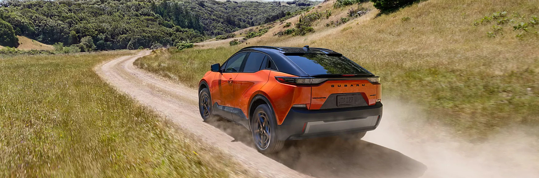 all new 2026 subaru uncharted driving on a dirt road