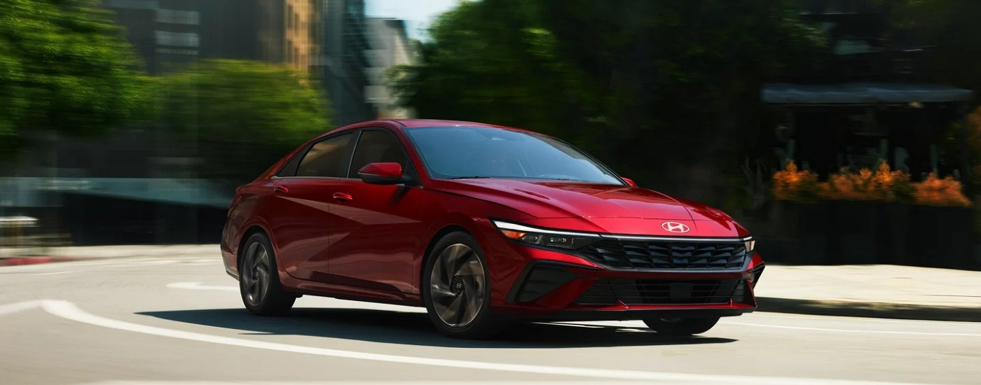A red 2025 Hyundai Elantra from the front at an angle.