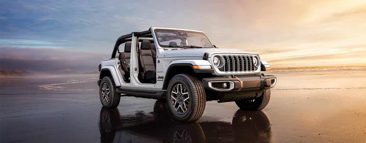 A white 2025 Jeep Wrangler from the side.