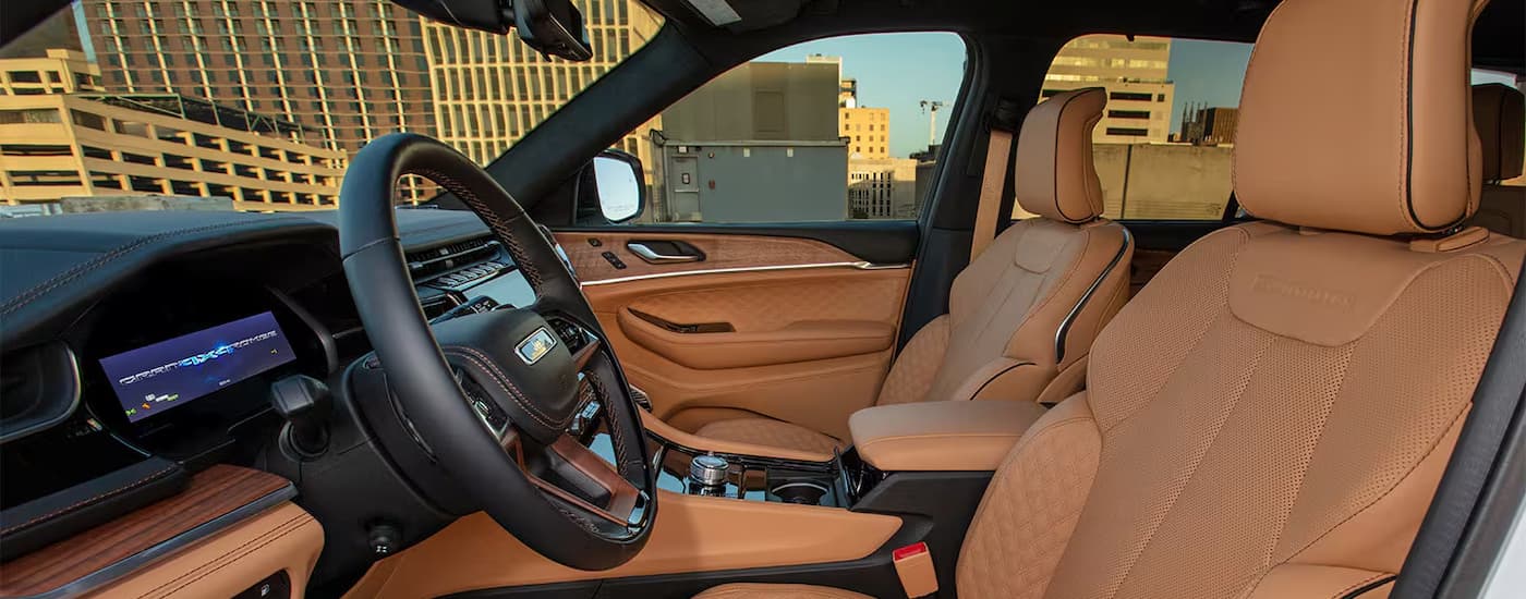Tan leather seats and dashboard in a 2025 Jeep Grand Cherokee