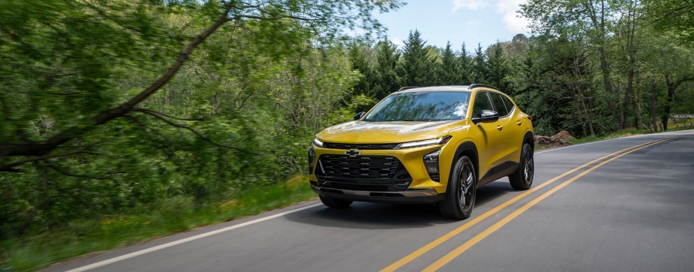 A yellow 2025 Chevy Trax from the front.