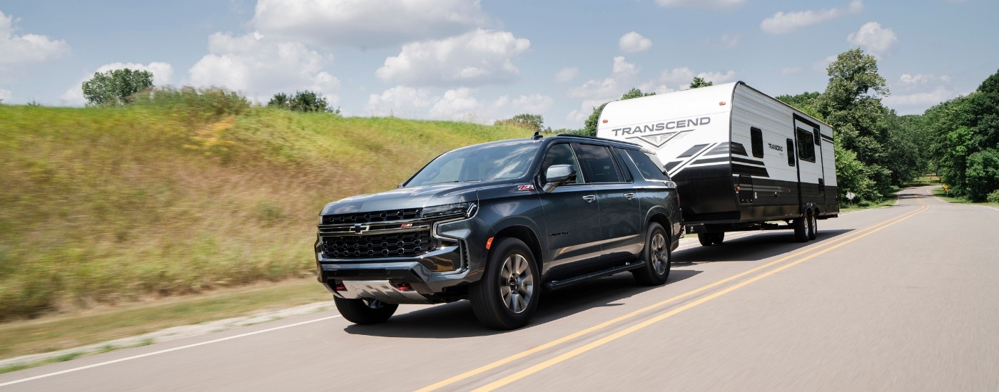 A grey 2025 Chevy Suburban from the front.