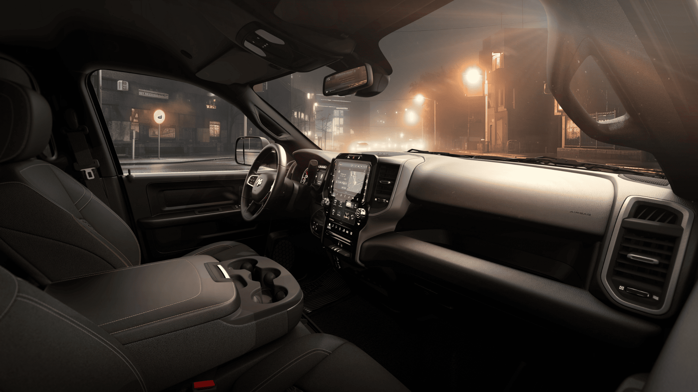 Interior of 2026 Ram Heavy Duty featuring modern dashboard and touchscreen navigation in low-light setting.