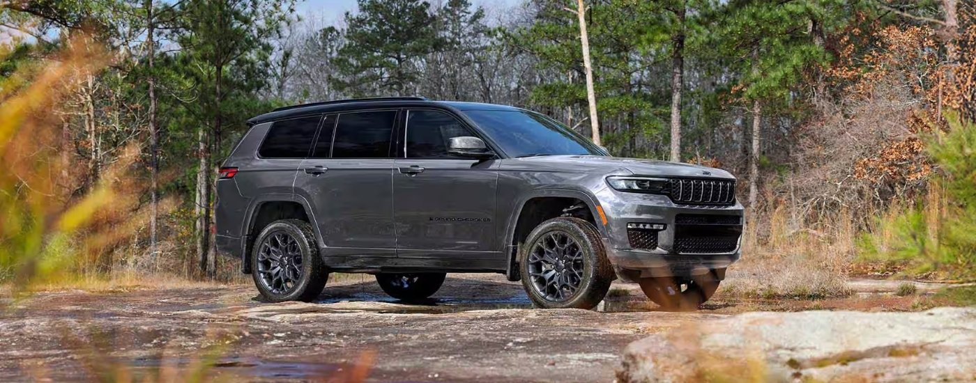 A grey 2025 Jeep Grand Cherokee for sale from the side.