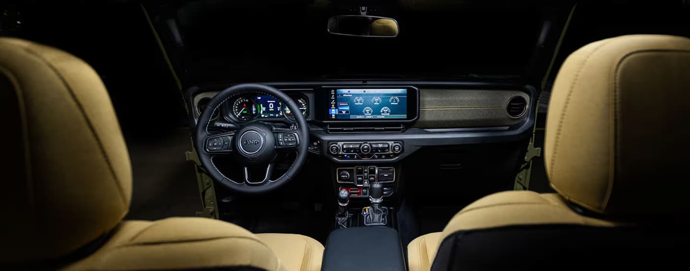 Tan leather seats and dashboard in a 2025 Jeep Wrangler for sale near Fulshear