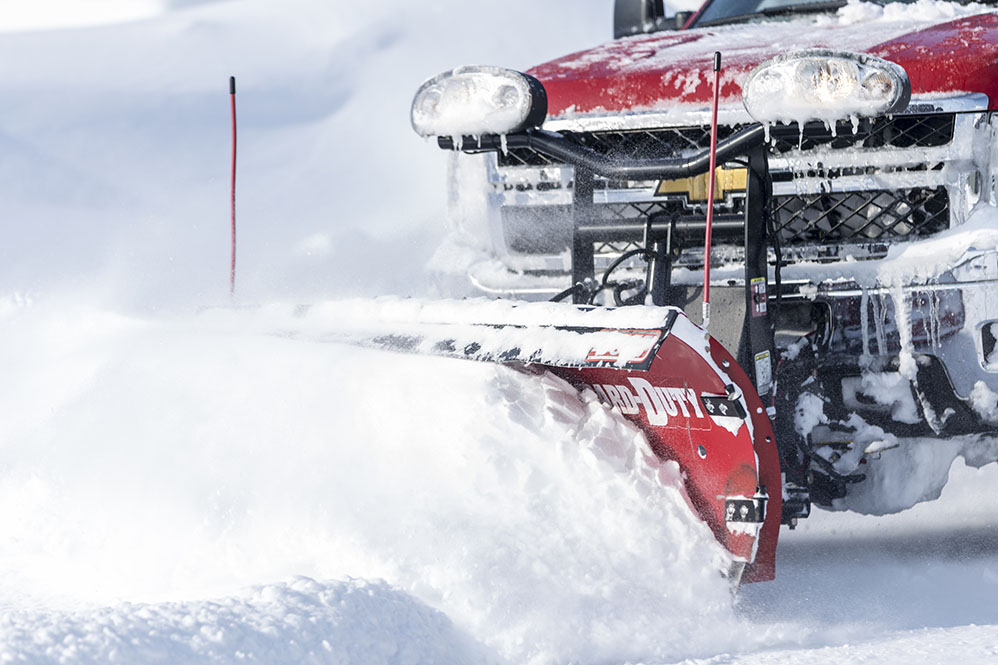 Commercial truck equipped with snowplow and winter equipment