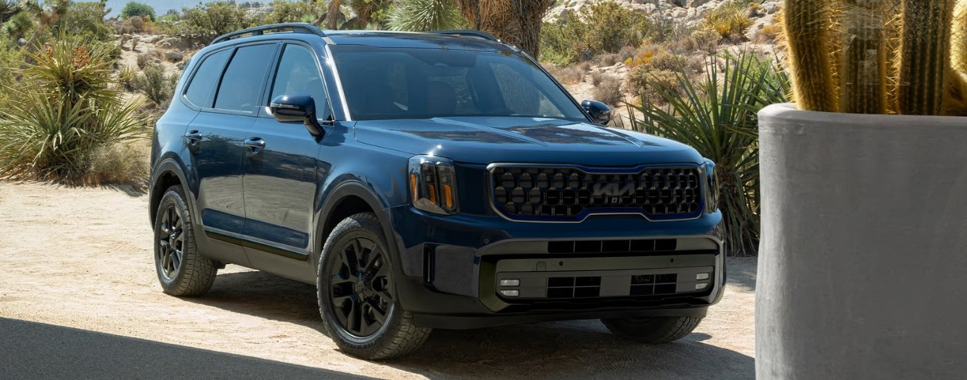 A blue 2025 Kia Telluride from the front at an angle after leaving a Kia dealer near Omaha.