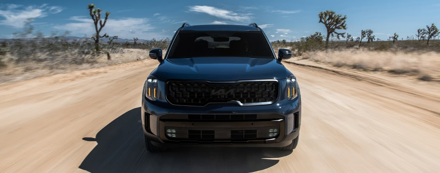 A blue 2025 Kia Telluride from the front.
