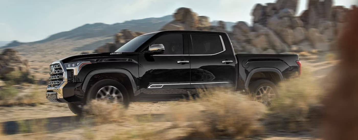 Black 2026 Toyota Tundra off-roading on a dusty trail