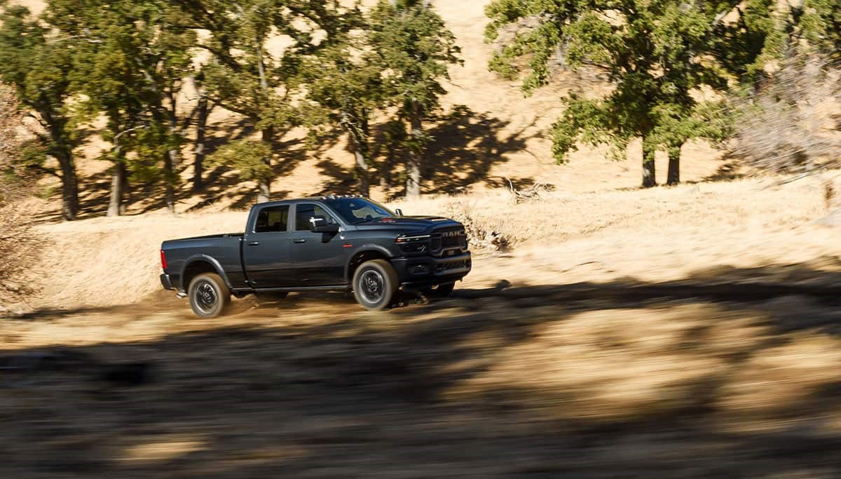 2026 RAM 2500 driving on a dirt road