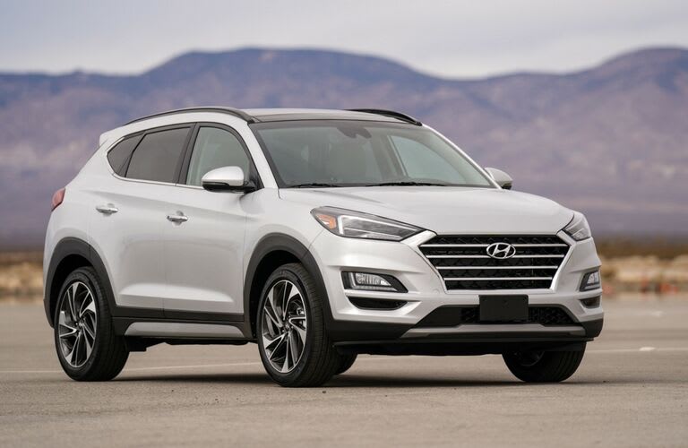 White 2019 Hyundai SUV parked out in a desert.