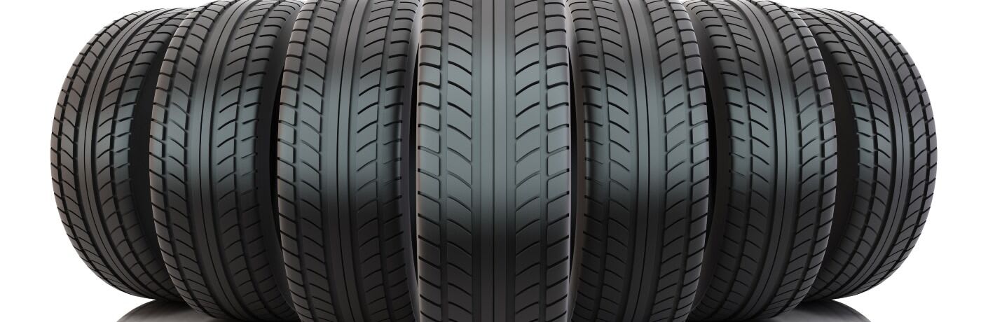 big group of tires standing on a white background.