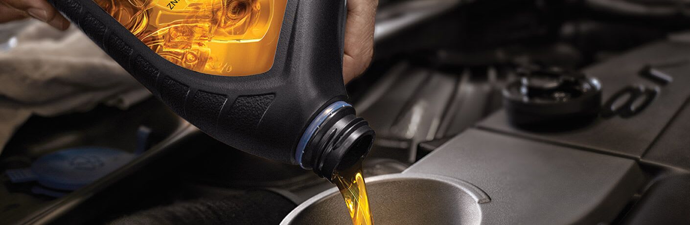 Oil poured into a waiting vehicle