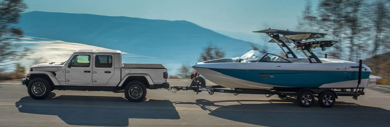 2023 Jeep Gladiator towing a boat
