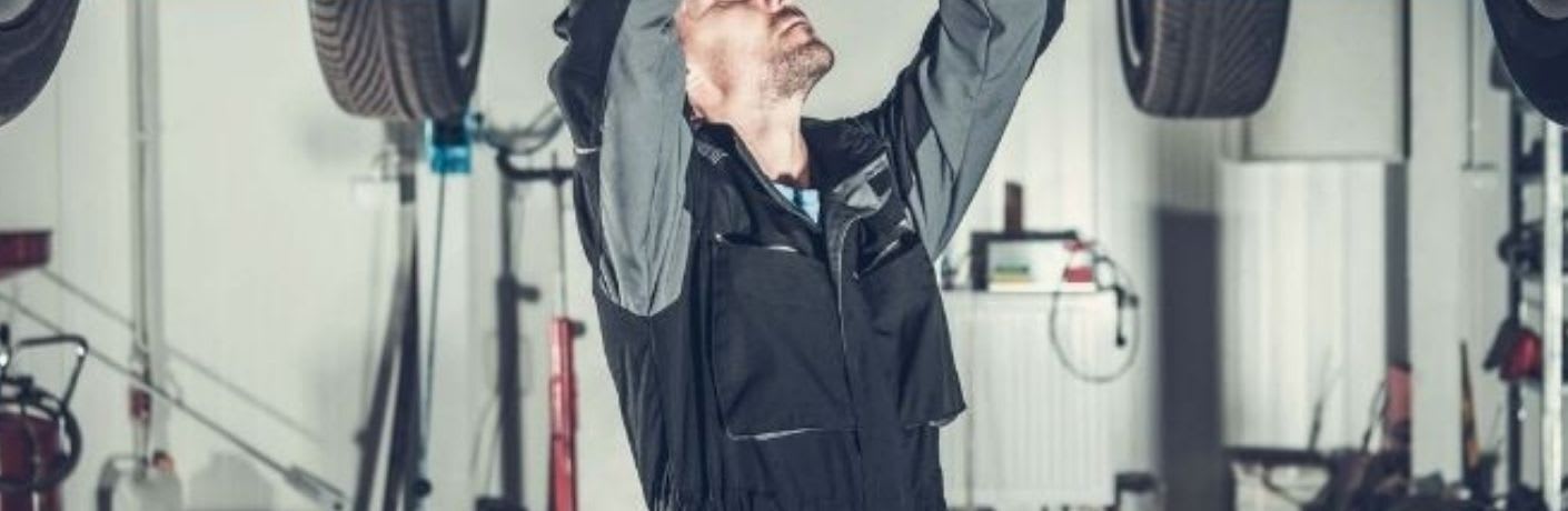 A mechanic working on a vehicle
