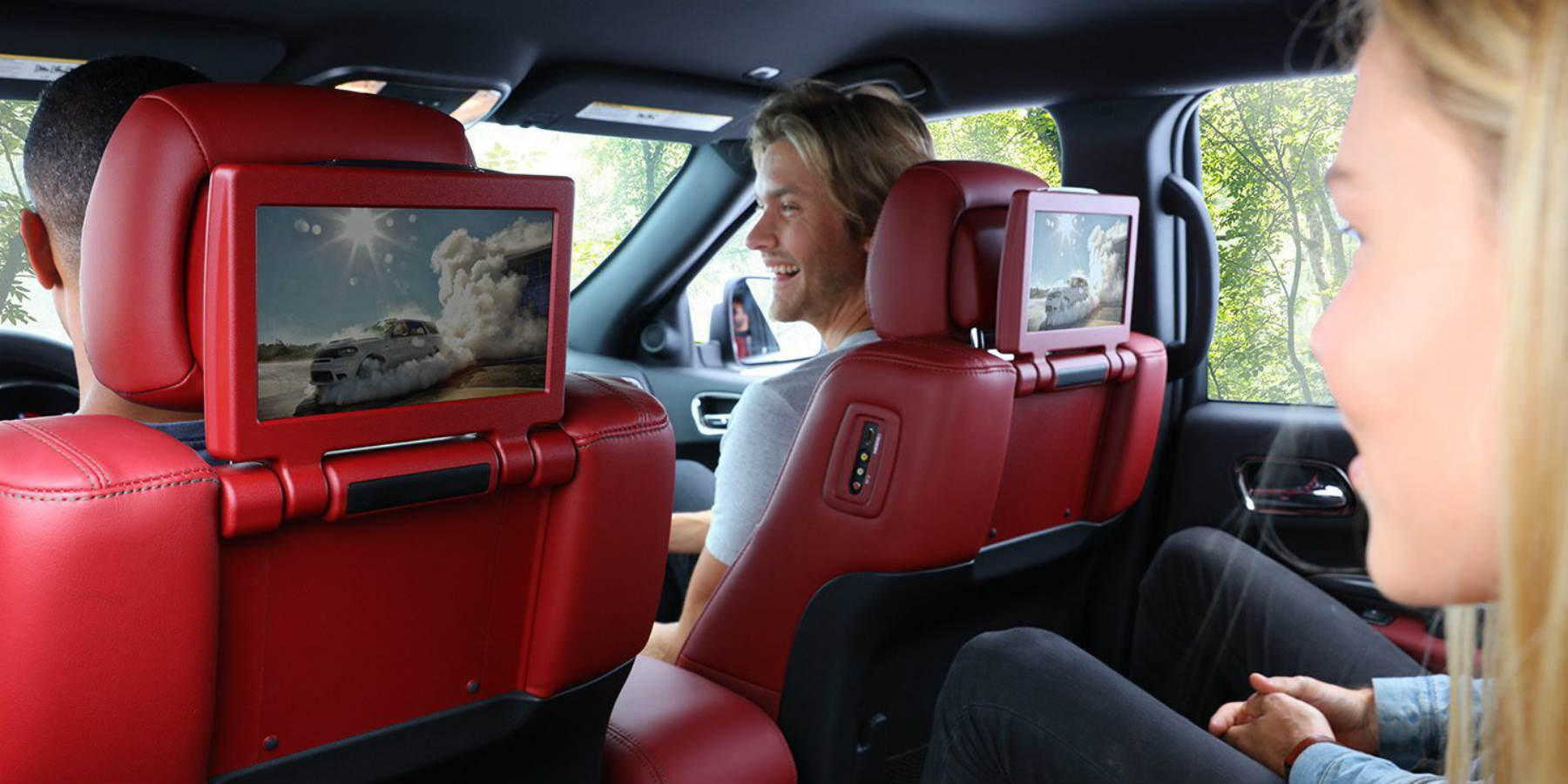 Dodge Durango Longview, TX - red interior of Dodge Durango with passengers