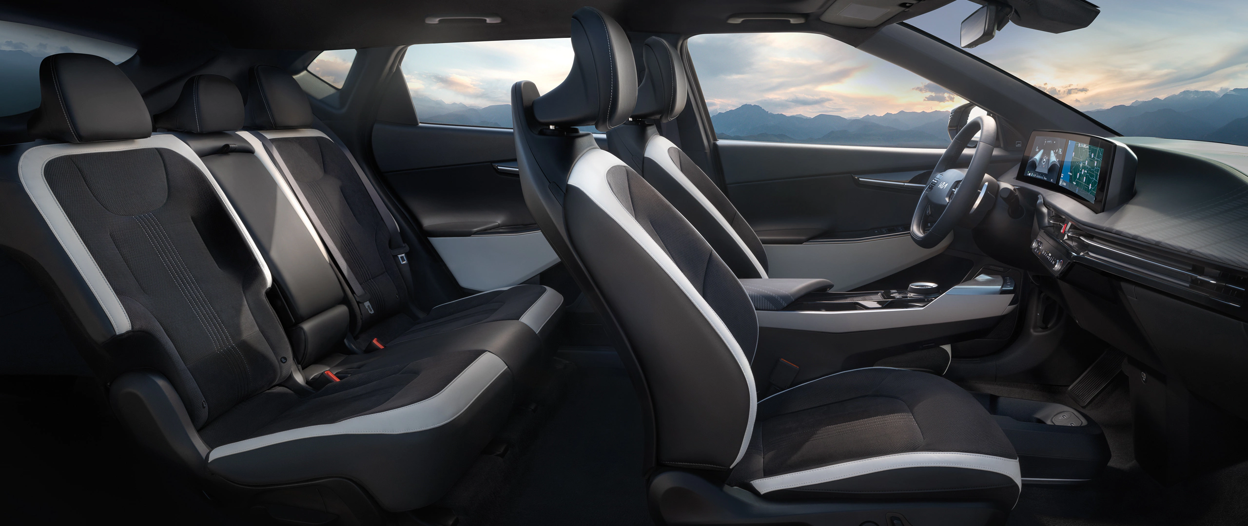 Interior passenger side view, black seats with white trim