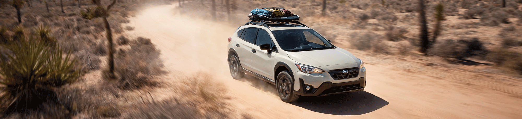 A 2023 Crosstrek driving in a desert. 
