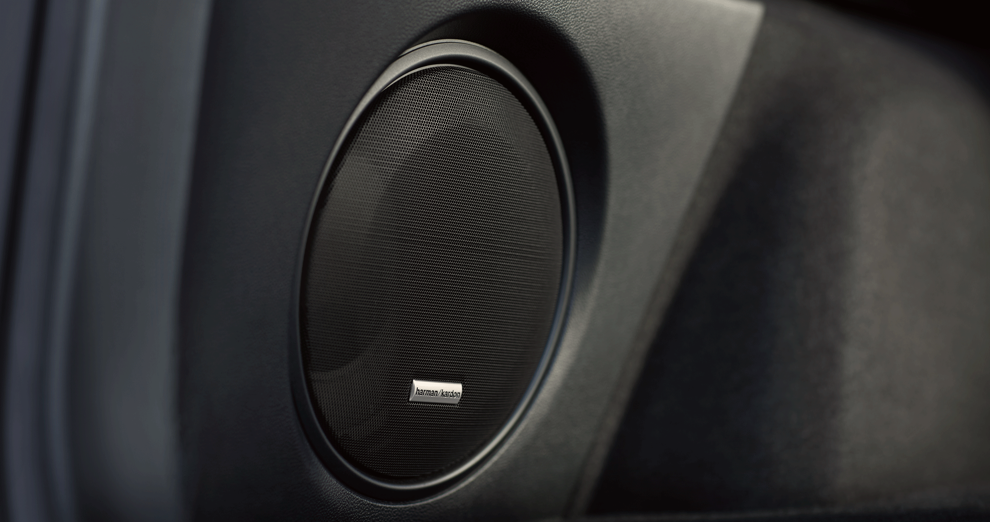 A close-up of one of the speakers for the Harman Kardon premium audio system available on the 2023 Outback.
