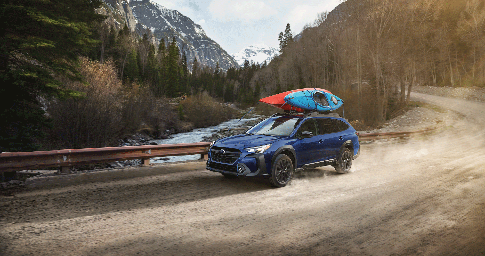 A 2023 Outback driving on a mountain road