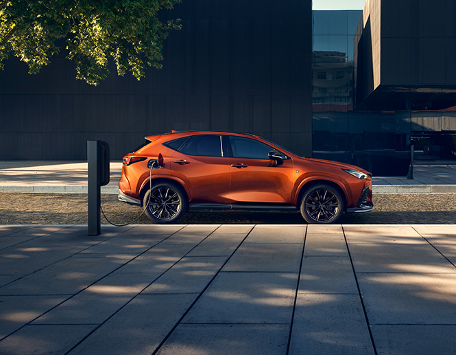 Exterior of the Lexus NX Plug-in Hybrid Electric Vehicle shown in Cadmium Orange.