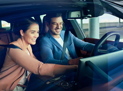A couple inside a BMW getting ready for a drive