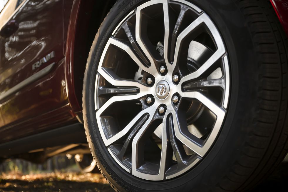 Rear view of Blue Acura sitting in a showroom