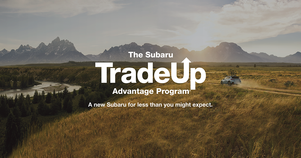 A blue 2023 Subaru Crosstrek in blue with the sentence 'The Subaru TradeUp Advantage Program'