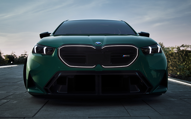 BMW M5 Touring exterior highlights and grille glow.