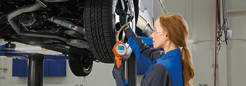 Subaru Certified Technician inspecting a vehicle
