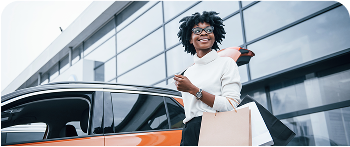 Lady Holding a Bag opening car door.