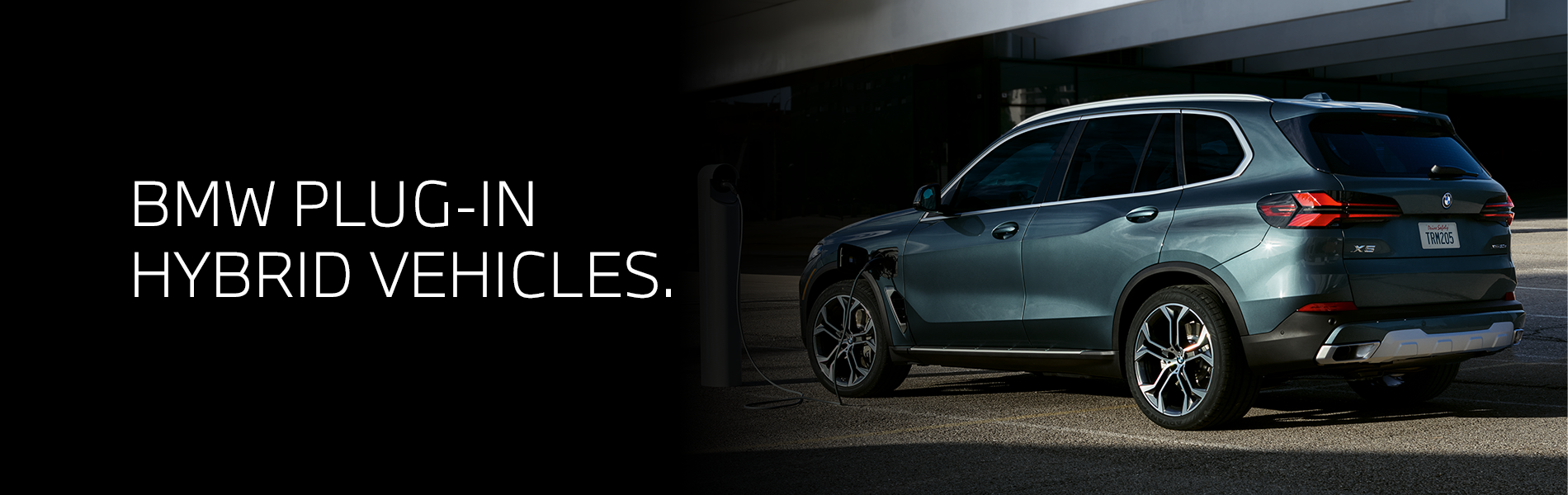 Parked BMW X5 charging.