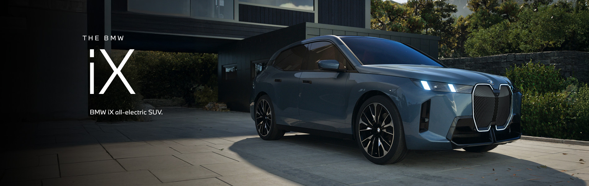 The BMW iX SUV parked. Click to learn more.