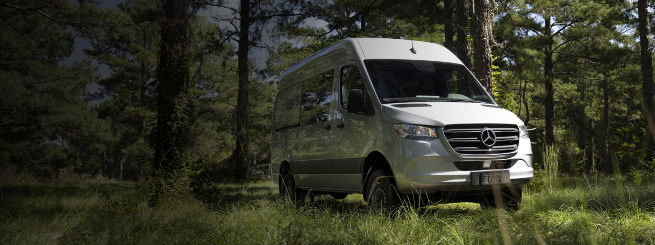 Van driving along a mountain road.