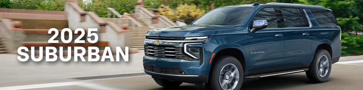 Blue 2025 Chevrolet Suburban driving on road